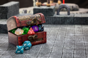A treasure chest filled with dice and game pieces