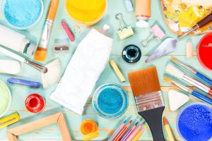 Painting equipment on a green shabby background