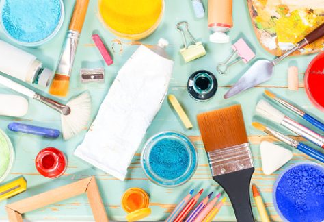 Painting equipment on a green shabby background