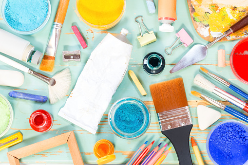 Painting equipment on a green shabby background