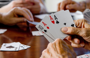An up close image of people holding cards