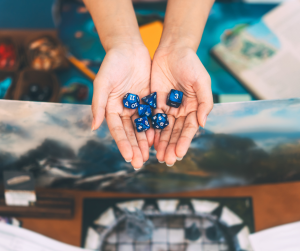 A stock image of a persons hands holding dice