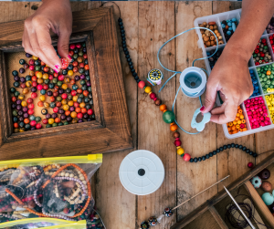 Person making handmade bracelets