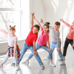 Kids dancing in a dance studio.