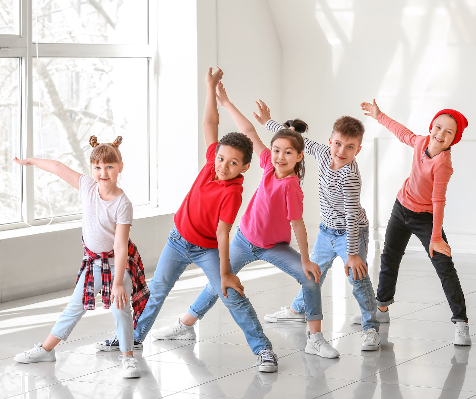 Kids dancing in a dance studio.