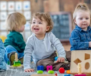 A group of toddler playing with blocks