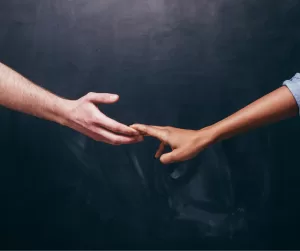 Two people holding hands